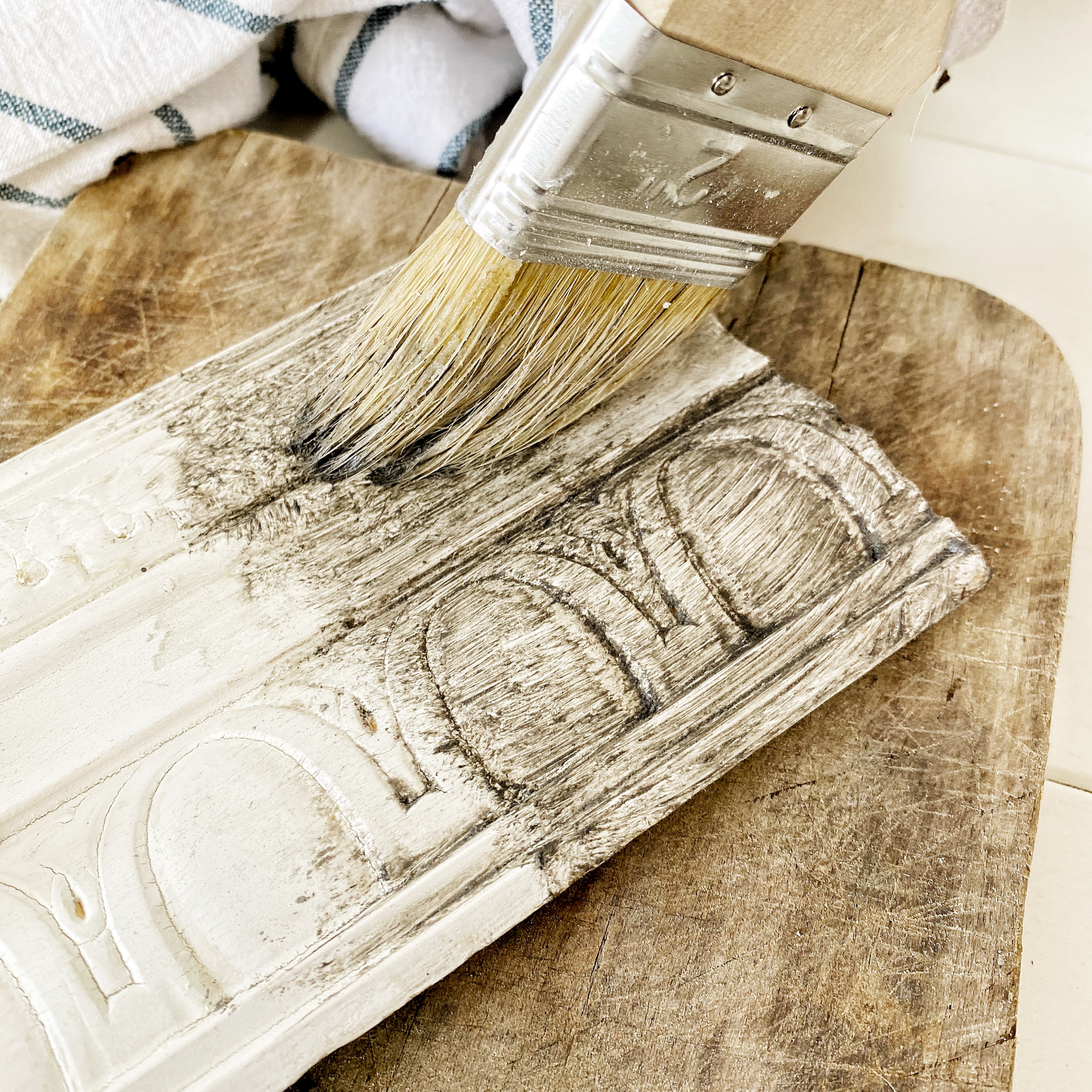 Applying Sweet Pickins Grit Aging Dust to carved furniture detail